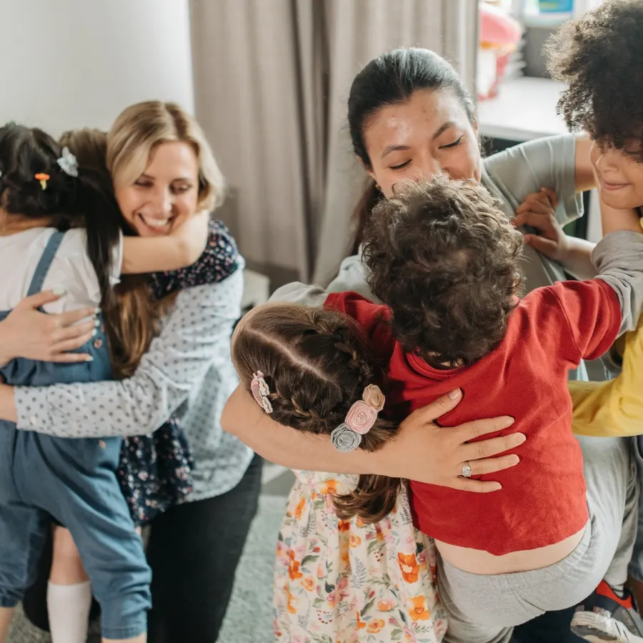 A family embracing at a caregiver support event